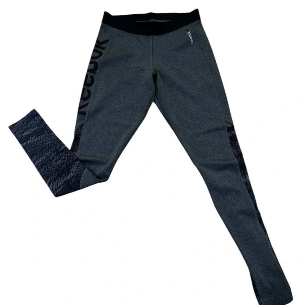 Reebok charcoal gray athletic leggings, mesh patterned detailing on side, S.